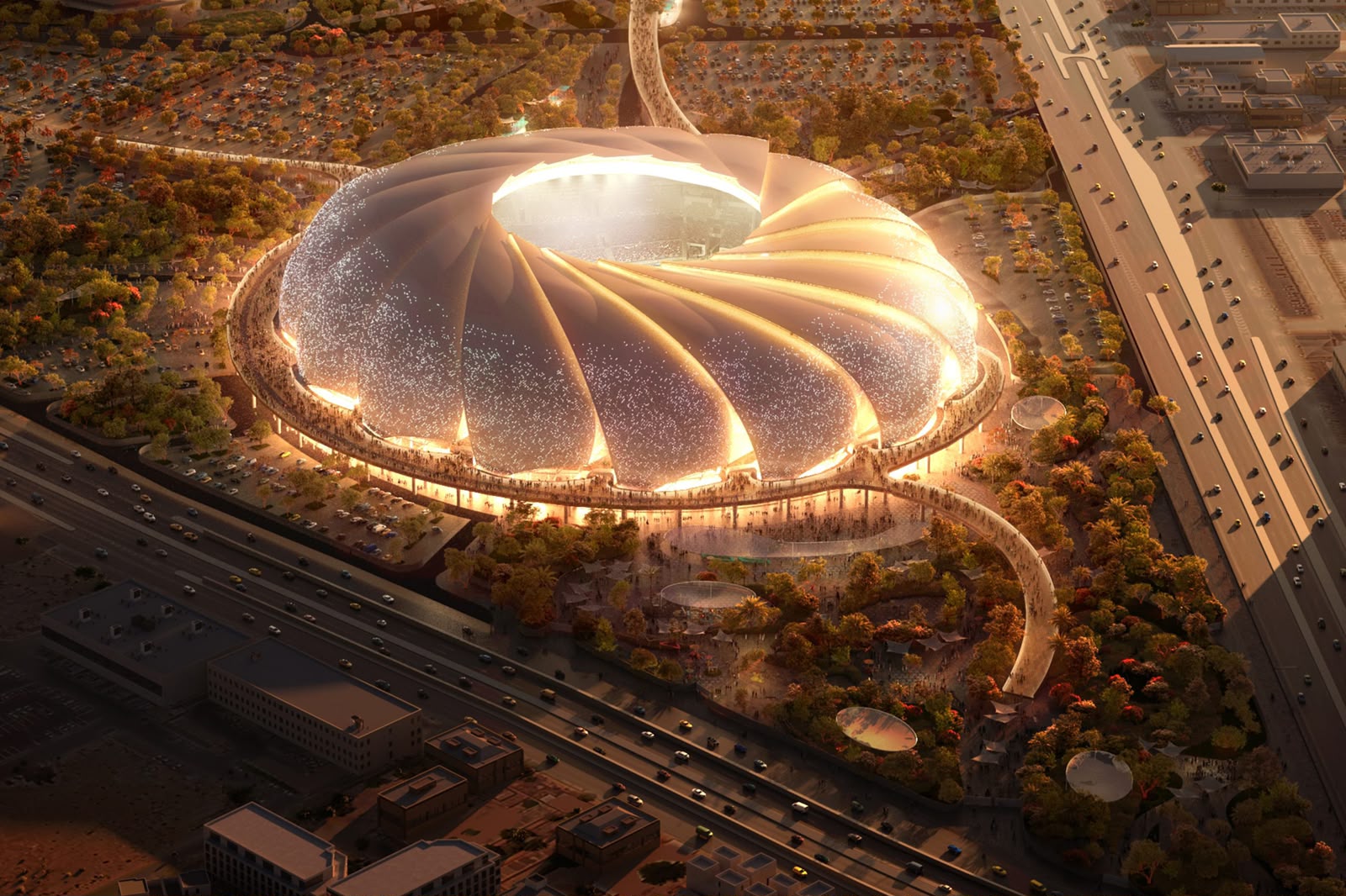 Illuminated Saudi stadium and surrounding destination development at dusk